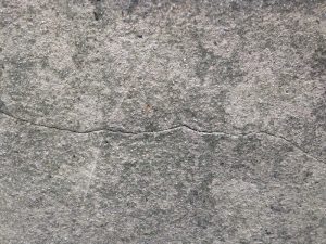 cracked render penetrating damp